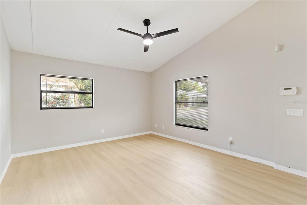 1368 21st Street Sarasota, FL 34234 - Photo 7 of 34 an empty room with windows and ceiling fan