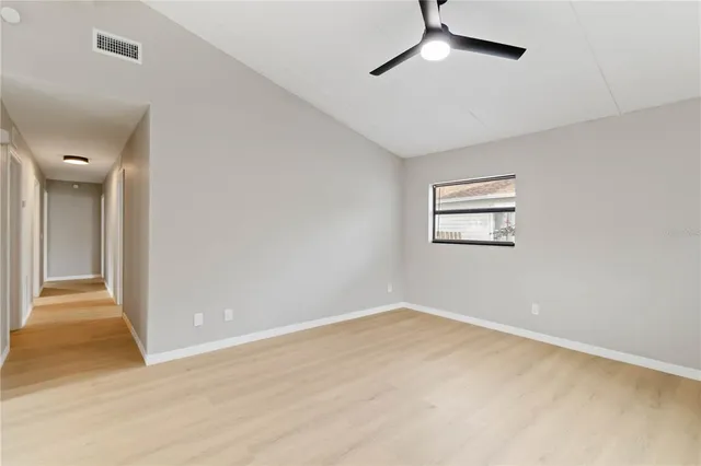 a view of an empty room with a window