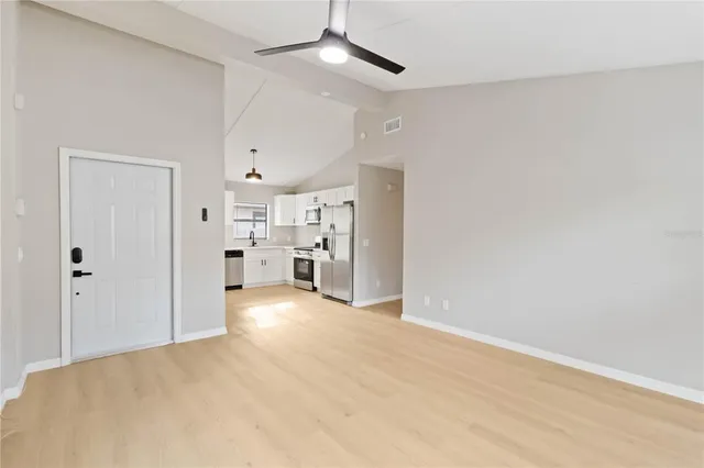 a view of an empty room with a window