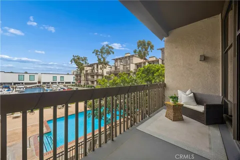 a view of a balcony with chairs