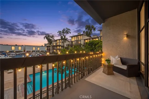a view of a balcony with chairs