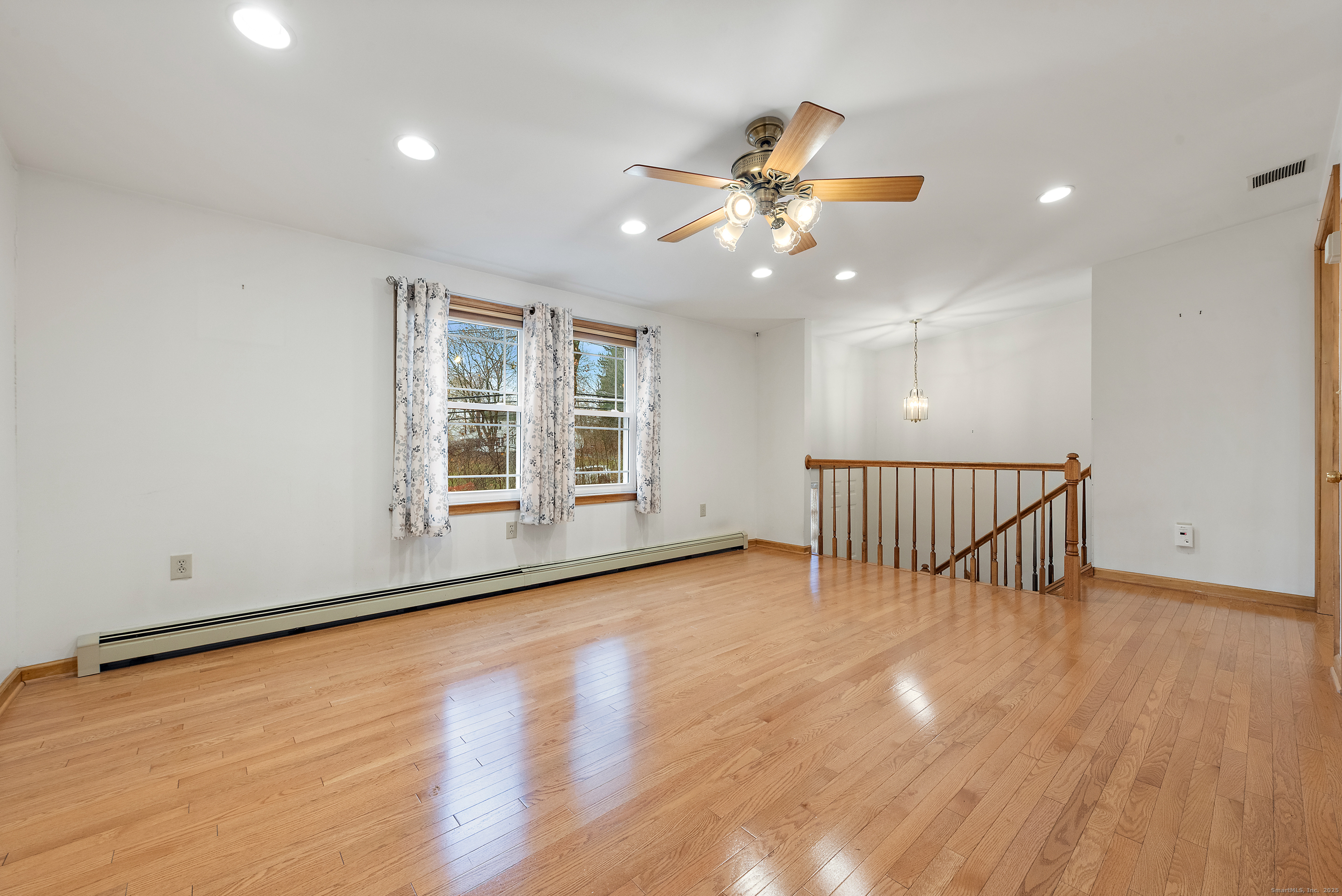 56 Great Hill Road Seymour, CT 06483 - Photo 11 of 40 a view of an empty room with a window and wooden floor