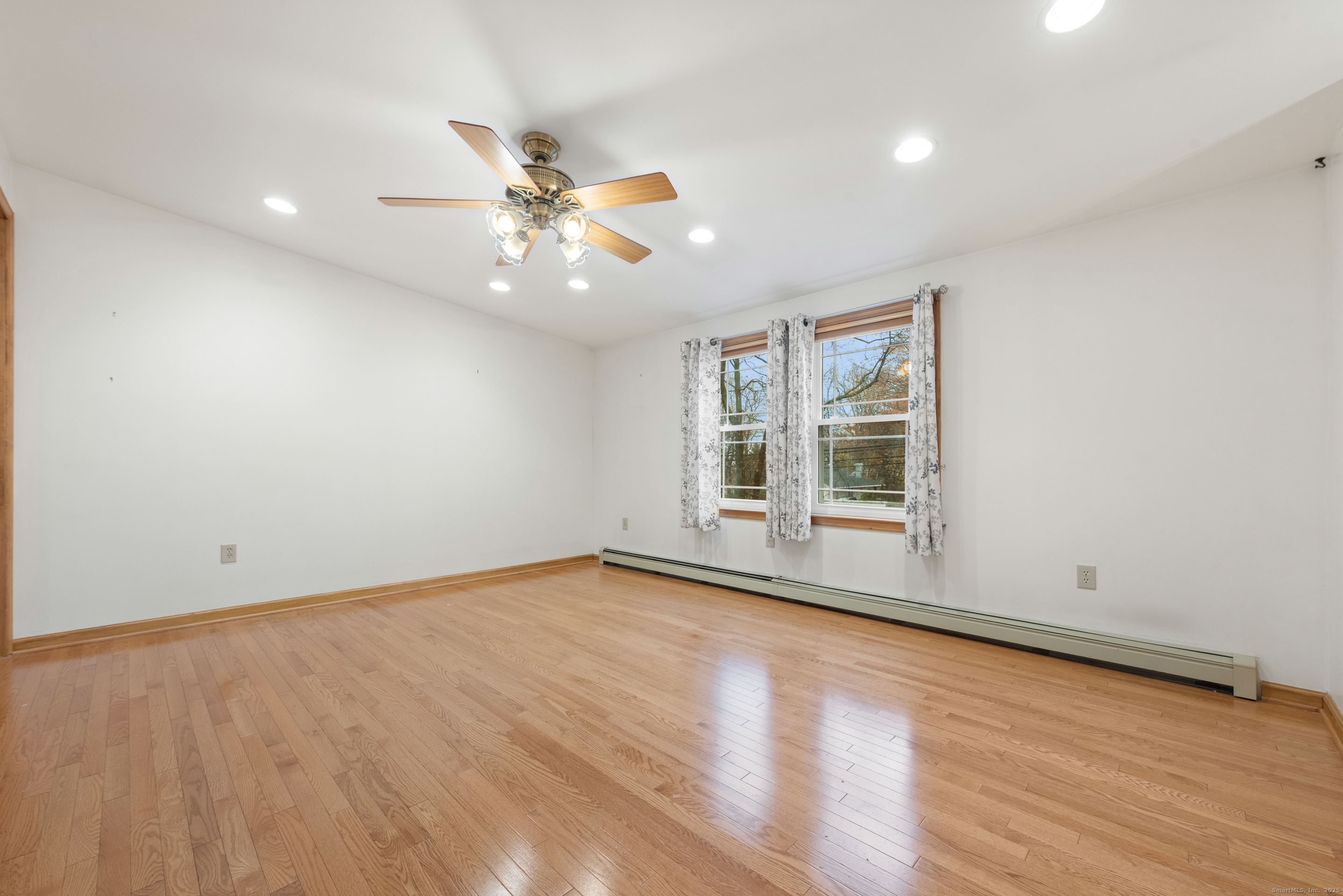 56 Great Hill Road Seymour, CT 06483 - Photo 13 of 40 an empty room with wooden floor and windows