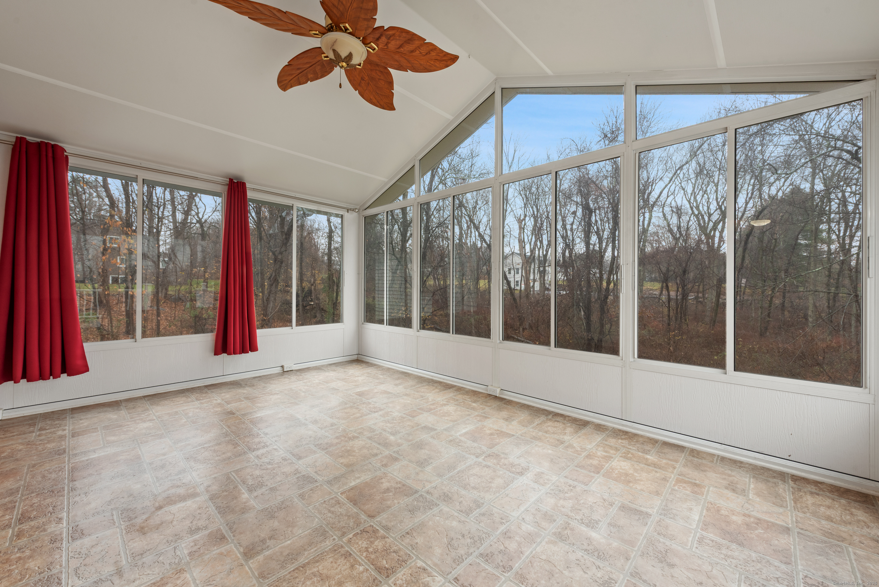 56 Great Hill Road Seymour, CT 06483 - Photo 14 of 40 a view of an empty room with a window and a ceiling fan