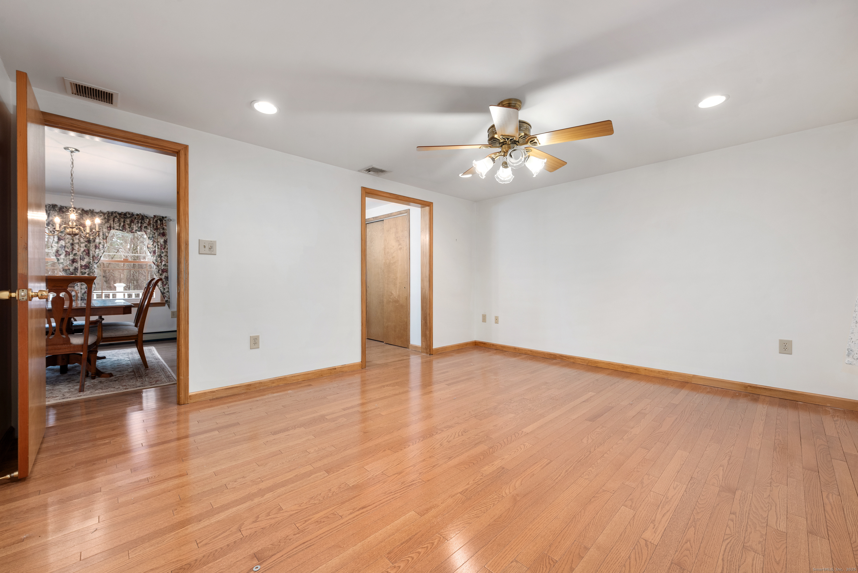 56 Great Hill Road Seymour, CT 06483 - Photo 18 of 40 an empty room with wooden floor and ceiling fan
