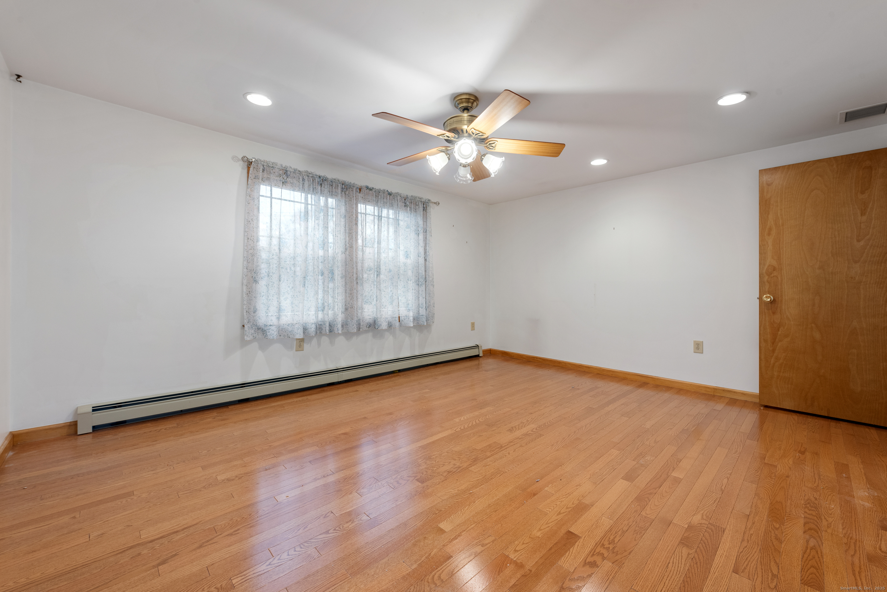 56 Great Hill Road Seymour, CT 06483 - Photo 19 of 40 wooden floor in an empty room with a window