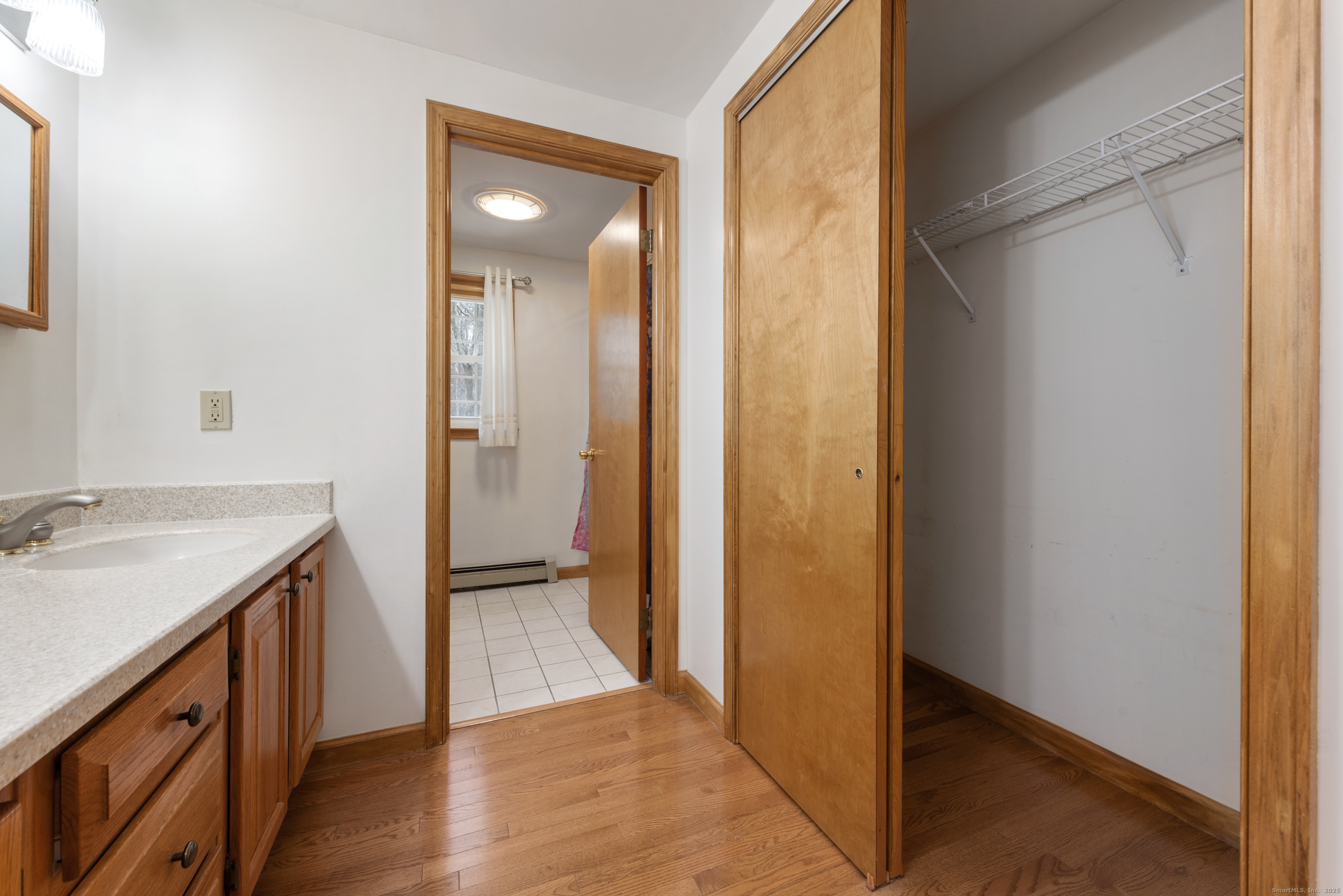 56 Great Hill Road Seymour, CT 06483 - Photo 21 of 40 a bathroom with a granite countertop sink and a mirror