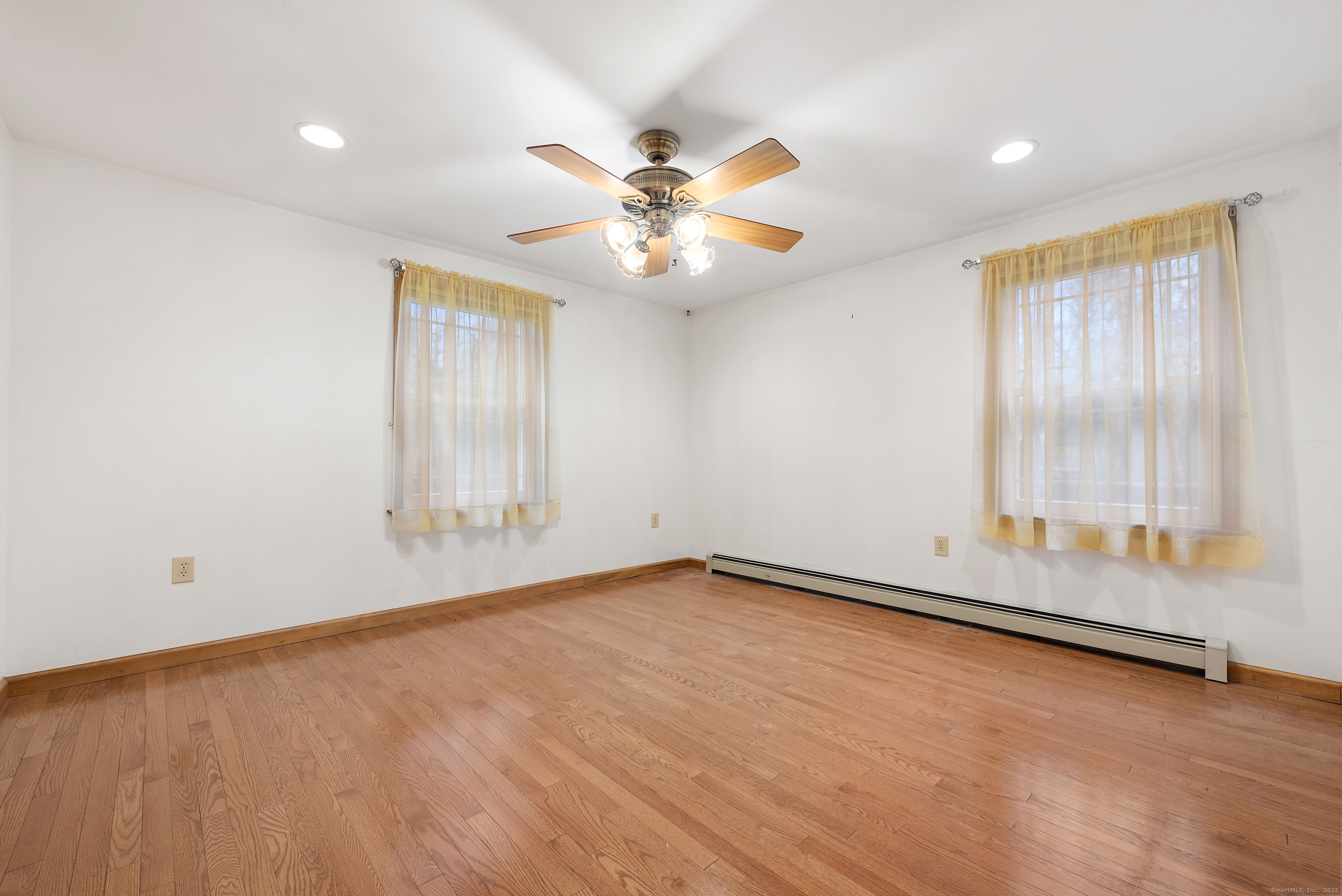 56 Great Hill Road Seymour, CT 06483 - Photo 22 of 40 an empty room with windows and fan