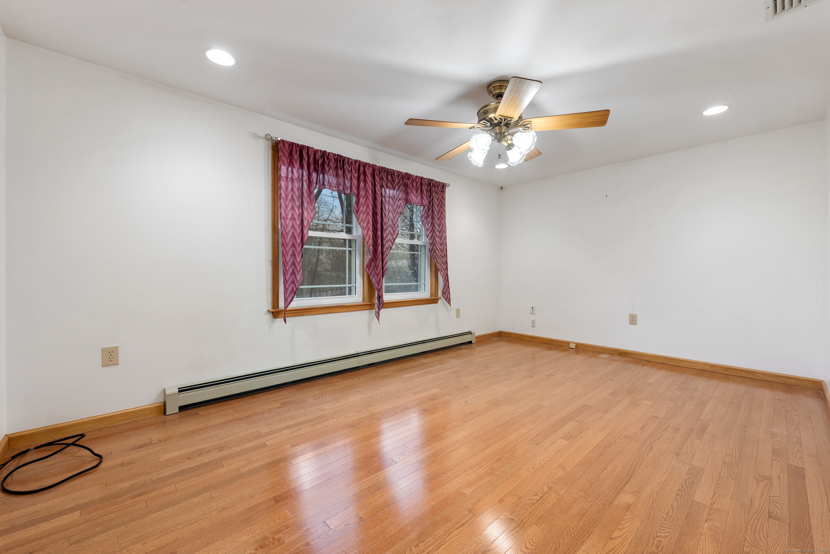56 Great Hill Road Seymour, CT 06483 - Photo 24 of 40 a view of an empty room with window and chandelier fan