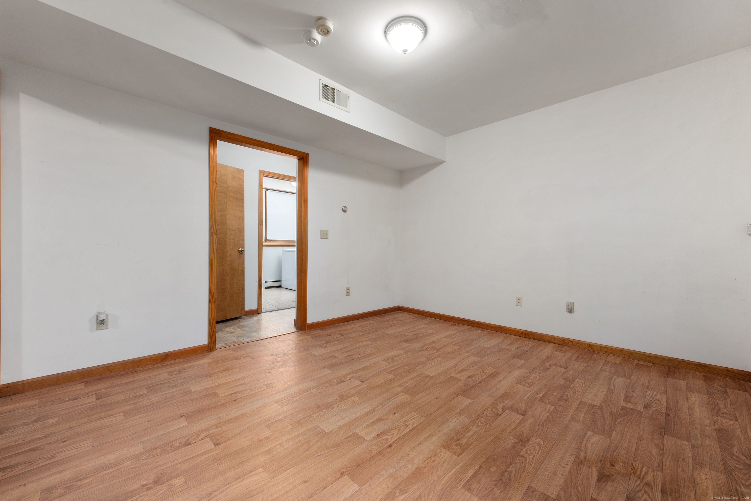 56 Great Hill Road Seymour, CT 06483 - Photo 28 of 40 a view of an empty room with wooden floor and closet