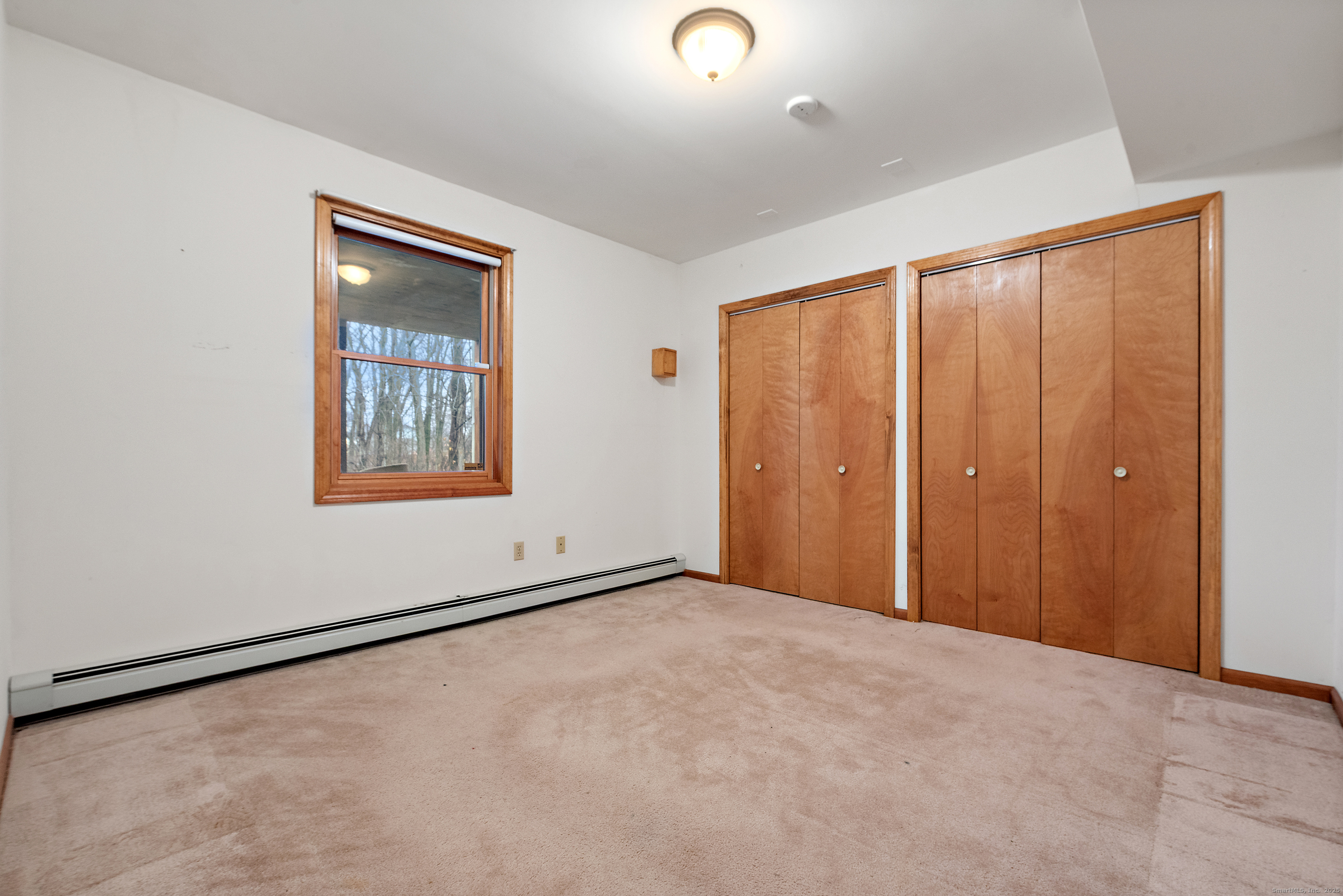 56 Great Hill Road Seymour, CT 06483 - Photo 30 of 40 an empty room with windows and closet
