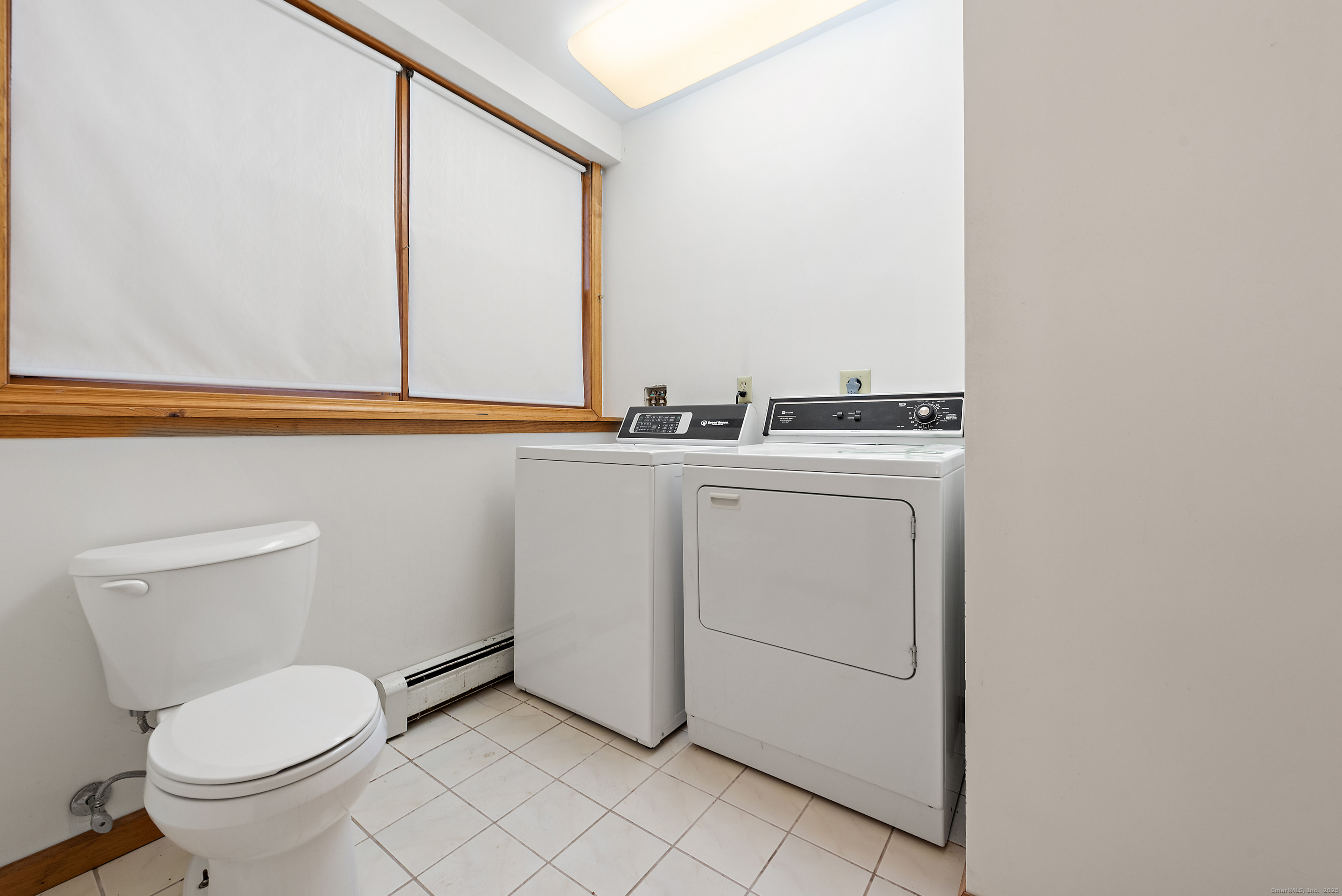 56 Great Hill Road Seymour, CT 06483 - Photo 33 of 40 a bathroom with a toilet sink and mirror