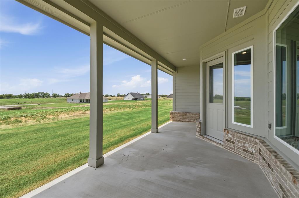 136 Hillview Trail Decatur, TX 76234 - Photo 23 of 26 Covered concrete patio with recessed lighting, brick accents, and direct access to interior via a glass-paneled door