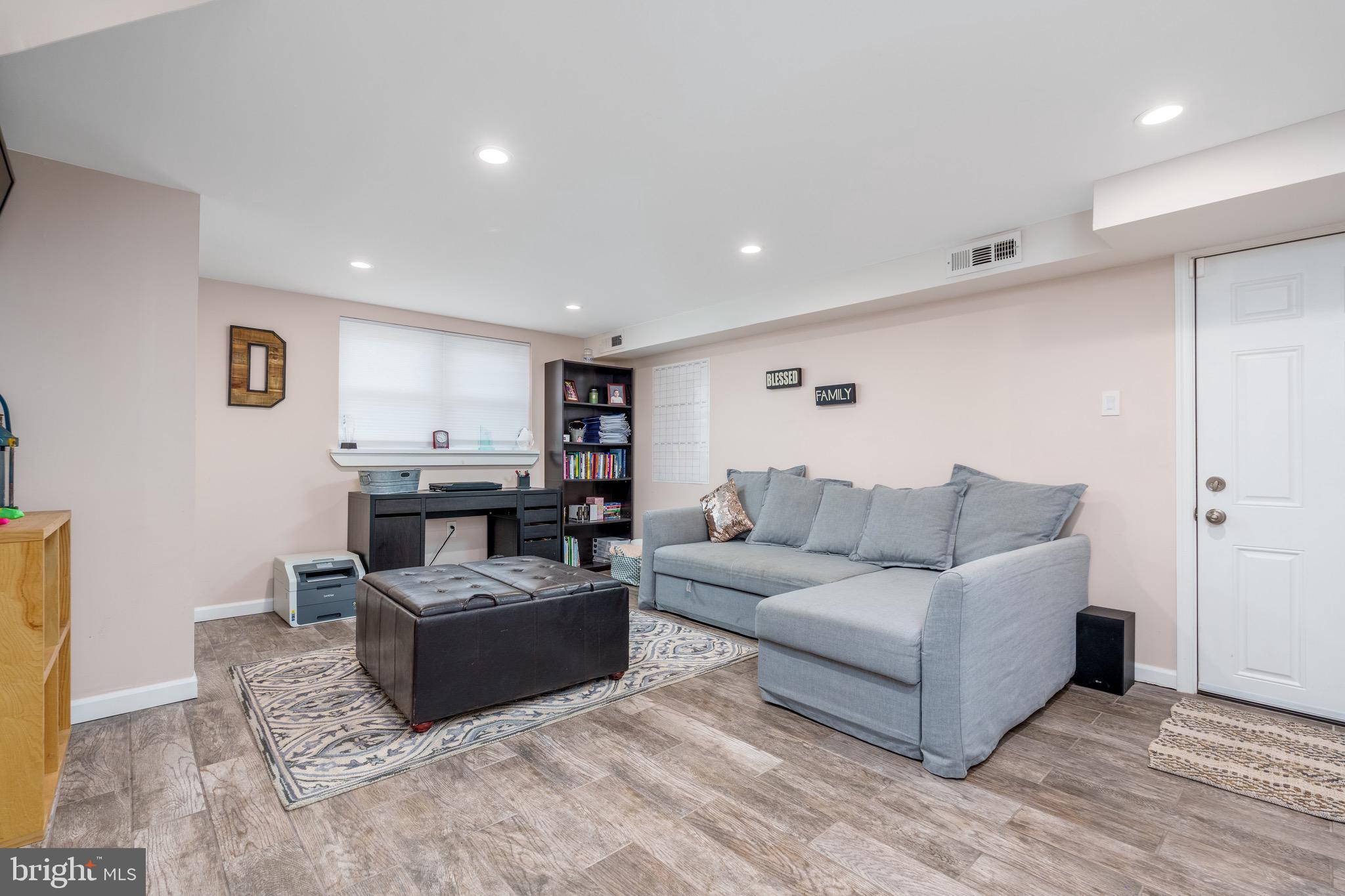 1003 Piper Road Wilmington, DE 19803 - Photo 19 of 40 a living room with furniture and a wooden floor