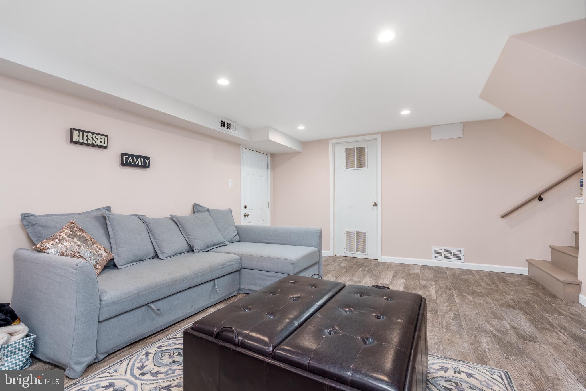 1003 Piper Road Wilmington, DE 19803 - Photo 20 of 40 a living room with furniture and stairs