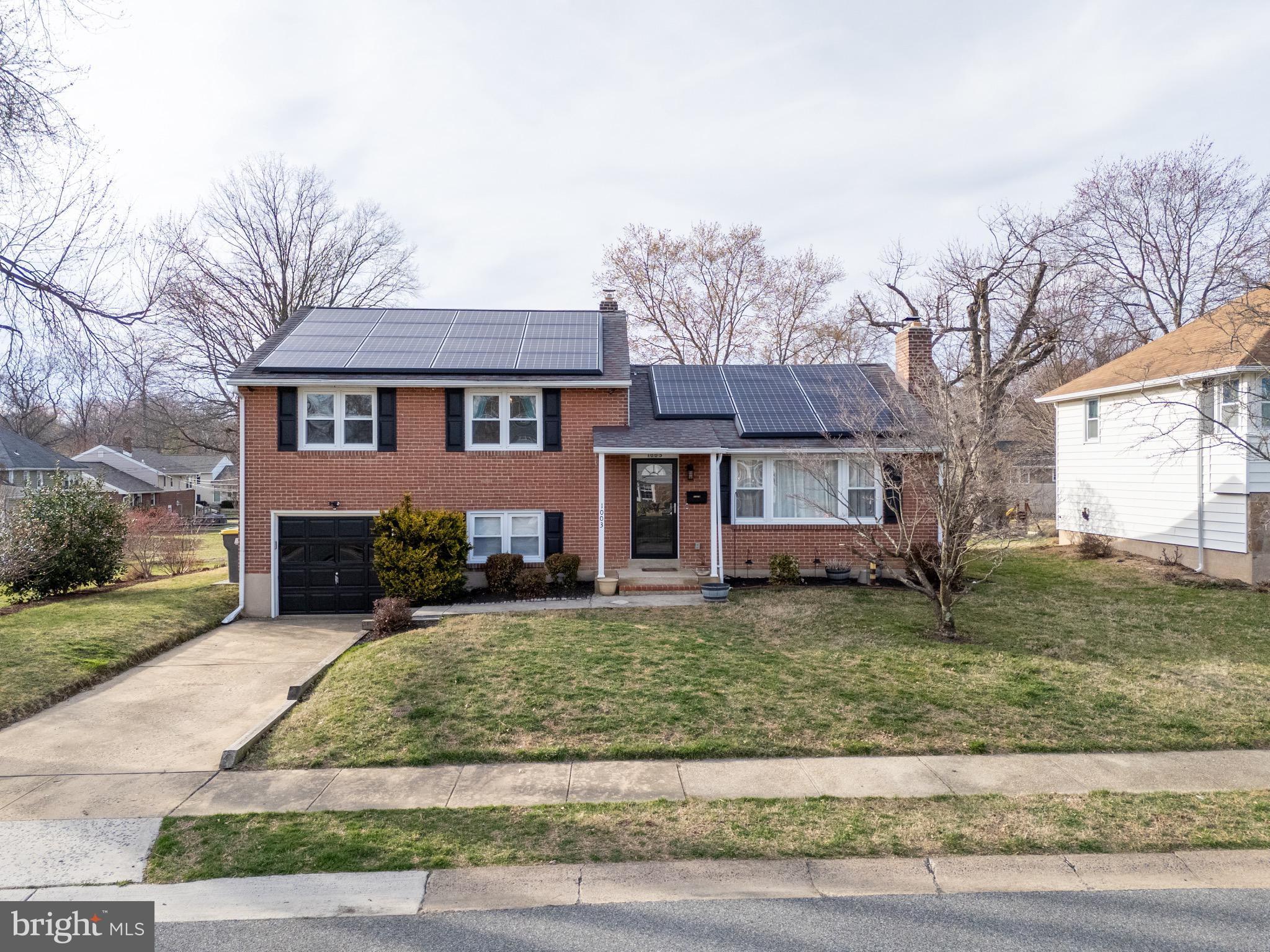 1003 Piper Road Wilmington, DE 19803 - Photo 2 of 40 front view of a house with a yard