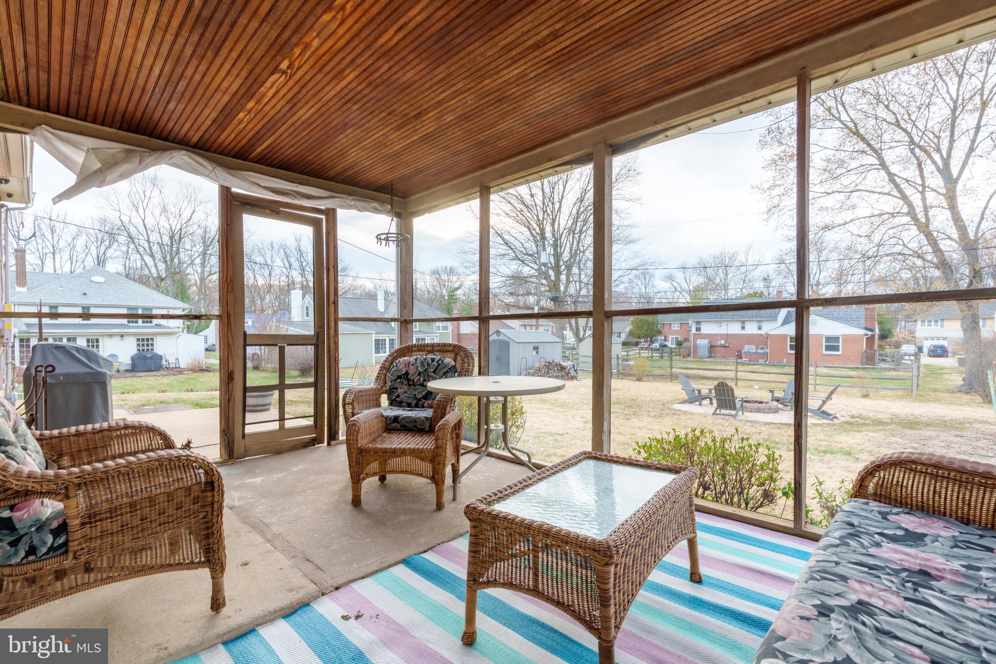 1003 Piper Road Wilmington, DE 19803 - Photo 24 of 40 a living room with furniture and a floor to ceiling window