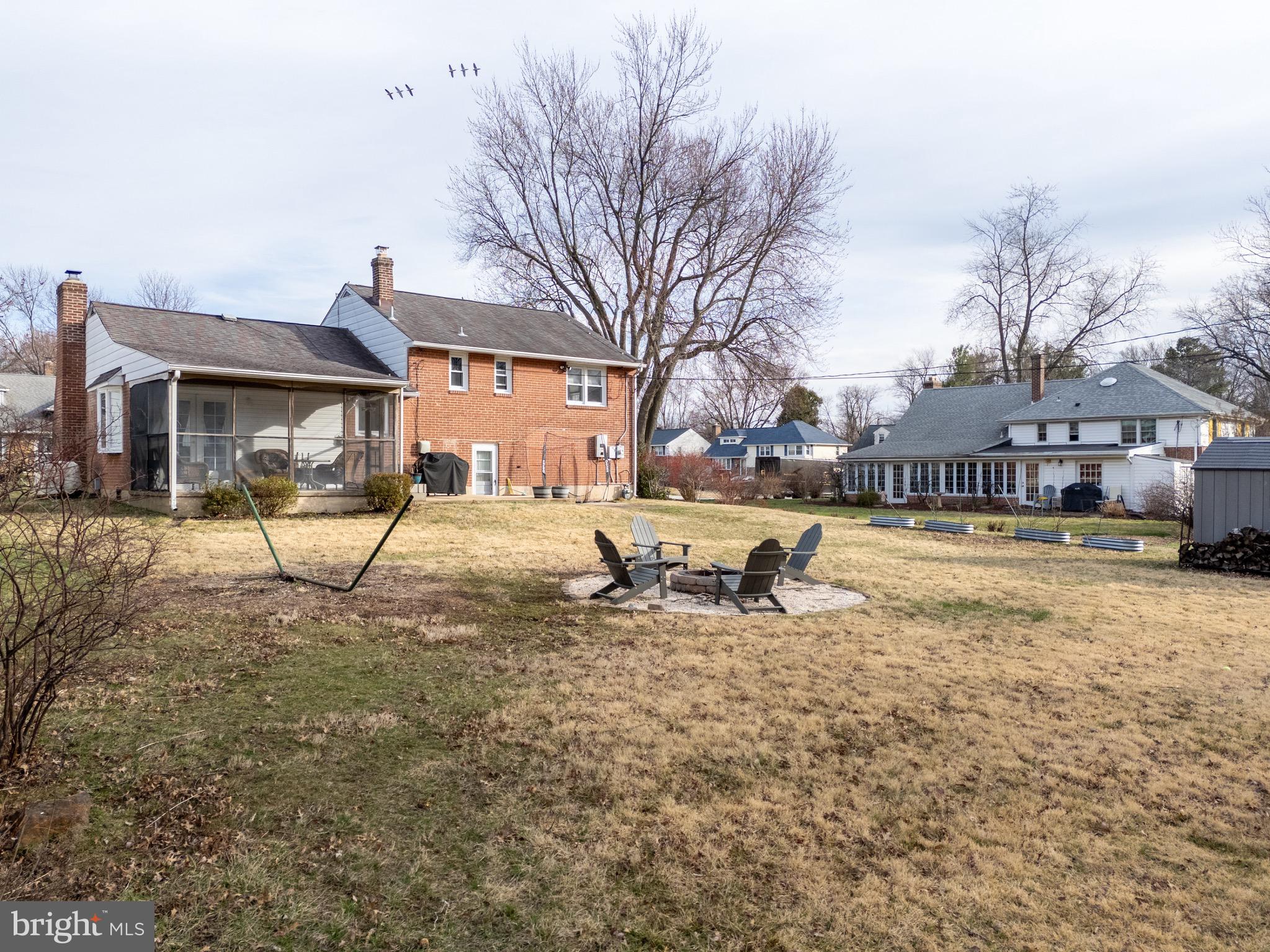 1003 Piper Road Wilmington, DE 19803 - Photo 31 of 40 a view of a house with a yard covered in snow
