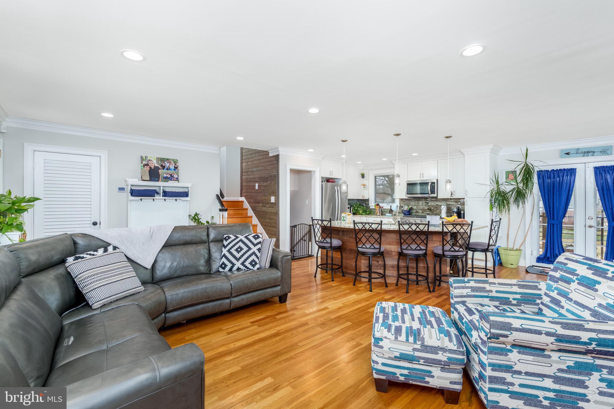 1003 Piper Road Wilmington, DE 19803 - Photo 8 of 40 a living room with furniture and wooden floor