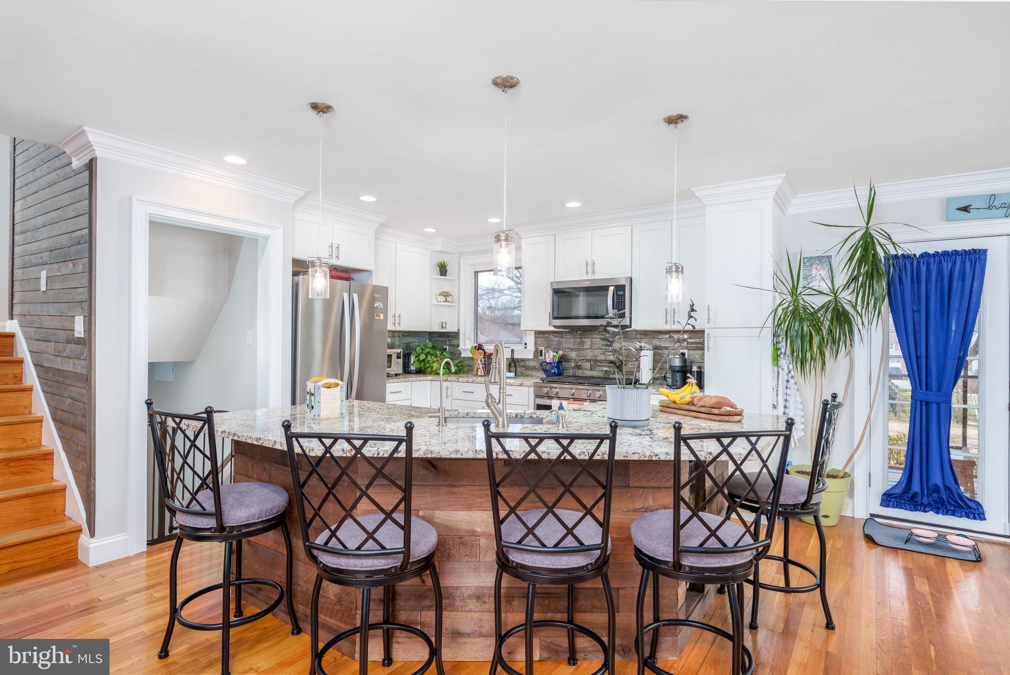 1003 Piper Road Wilmington, DE 19803 - Photo 9 of 40 a dining room with furniture and wooden floor