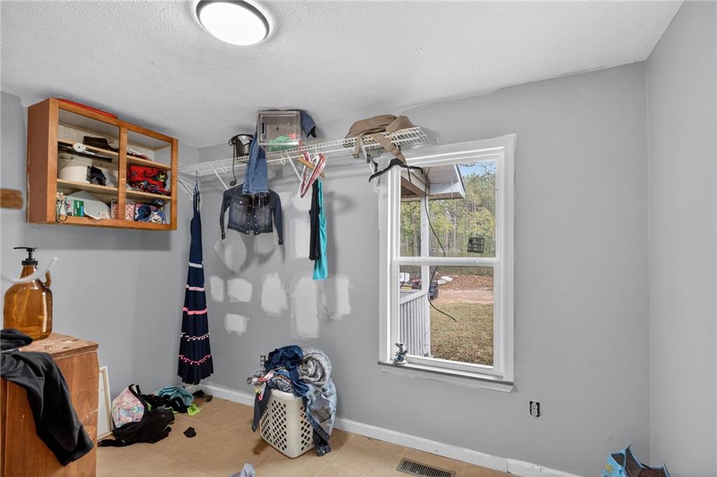 712 West 5th Highway Roopville, GA 30170 - Photo 13 of 29 a view of a room with storage and utility