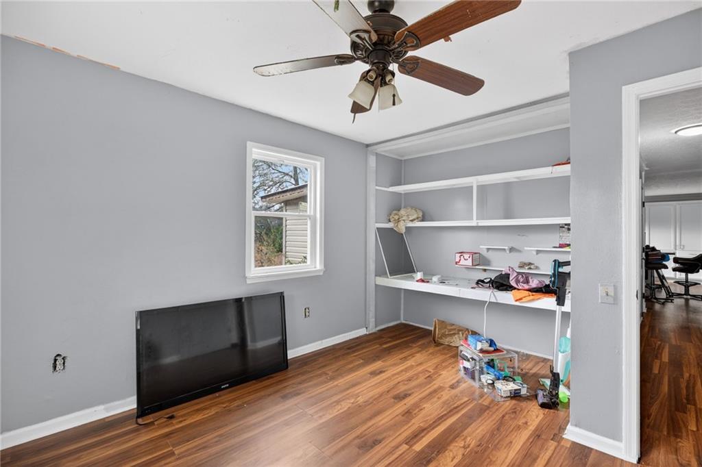 712 West 5th Highway Roopville, GA 30170 - Photo 17 of 29 a living room with hard wood floors and a window