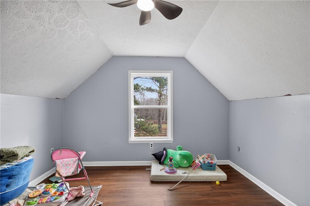 712 West 5th Highway Roopville, GA 30170 - Photo 18 of 29 a living room with furniture and a window