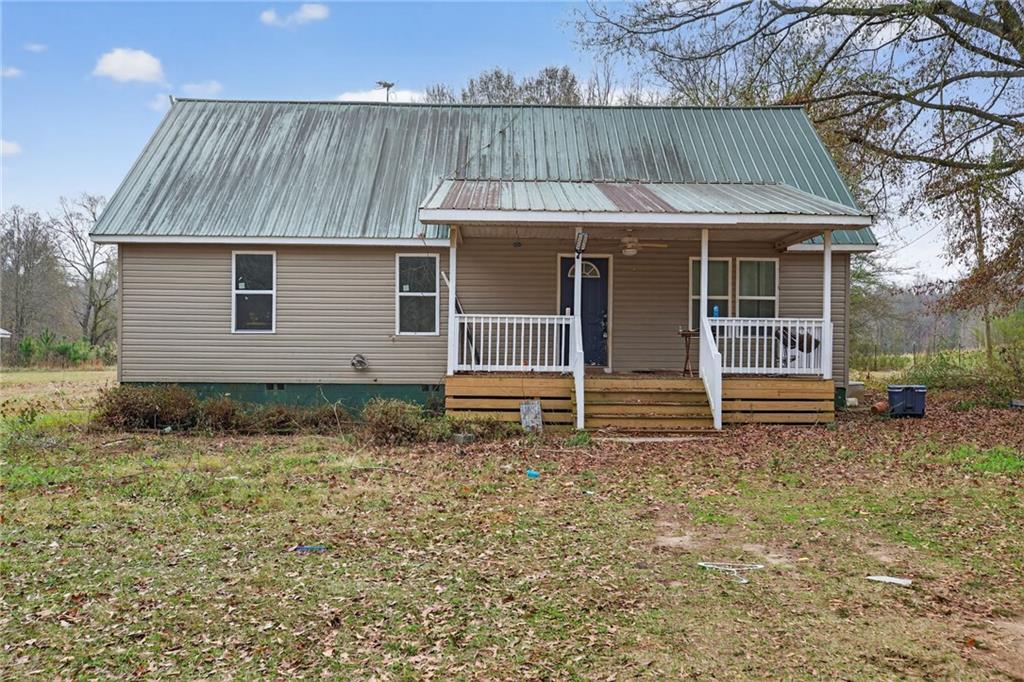 712 West 5th Highway Roopville, GA 30170 - Photo 2 of 29 a view of a house with a yard