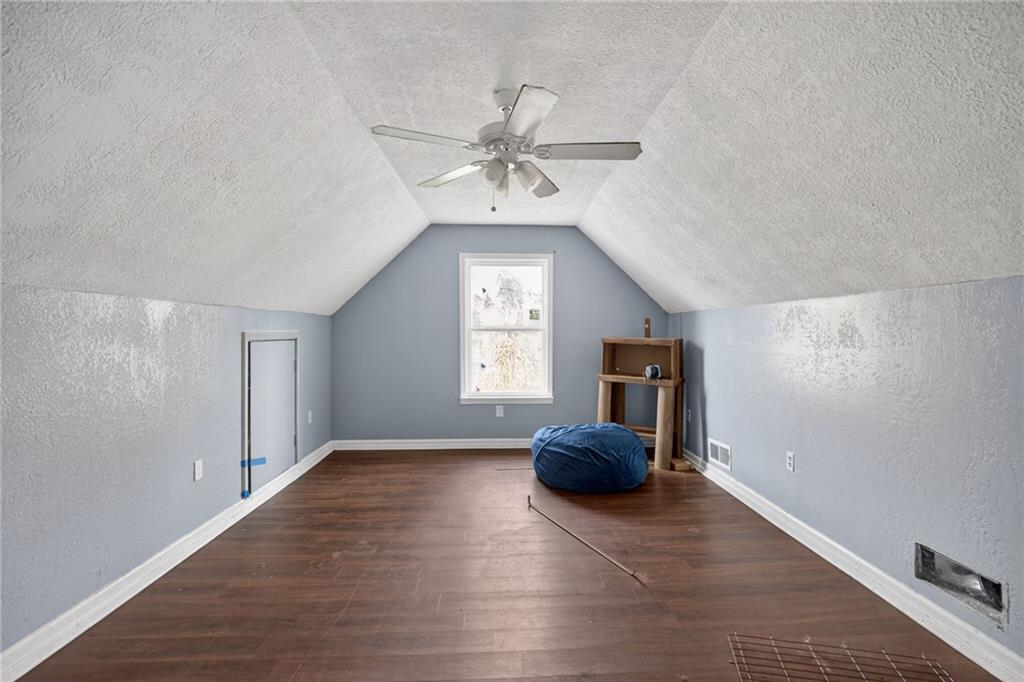712 West 5th Highway Roopville, GA 30170 - Photo 21 of 29 a view of a livingroom with wooden floor and windows