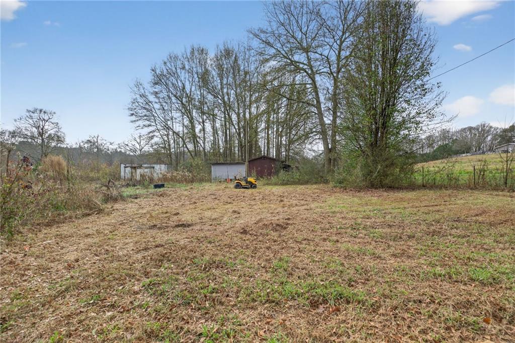 712 West 5th Highway Roopville, GA 30170 - Photo 22 of 29 a backyard of a house with lots of green space