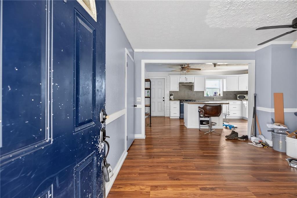 712 West 5th Highway Roopville, GA 30170 - Photo 3 of 29 a room with stainless steel appliances lots of wooden furniture and view of living room