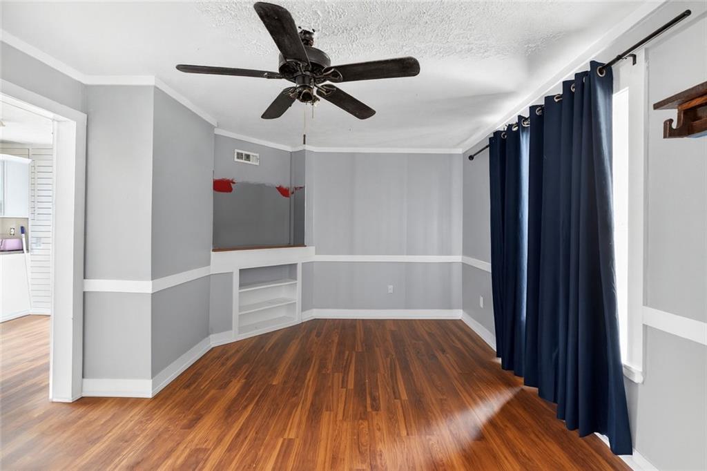 712 West 5th Highway Roopville, GA 30170 - Photo 4 of 29 a view of a hallway with wooden floor and staircase
