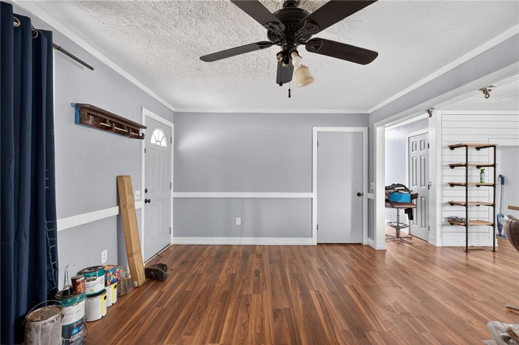 712 West 5th Highway Roopville, GA 30170 - Photo 7 of 29 wooden floor in an empty room with a window