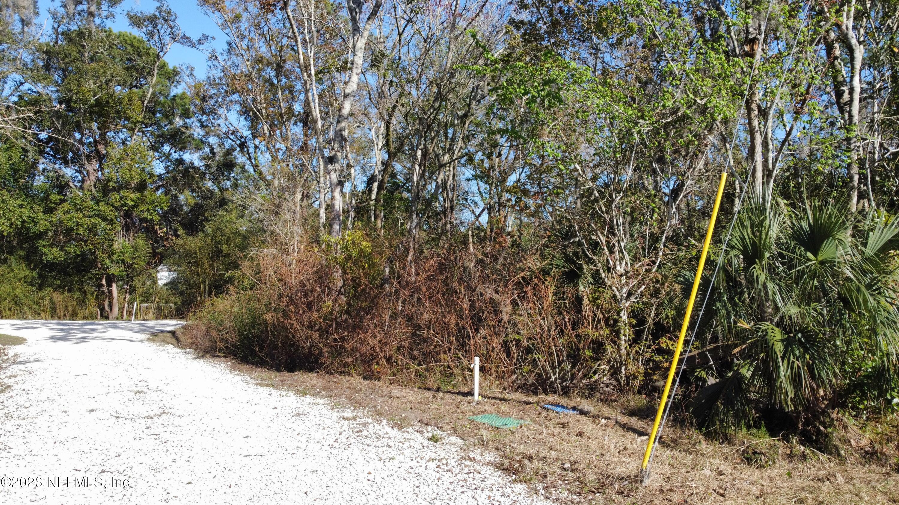 1030 Francis Street St. Augustine, FL 32084 - Photo 3 of 10 a view of wooden fence and trees