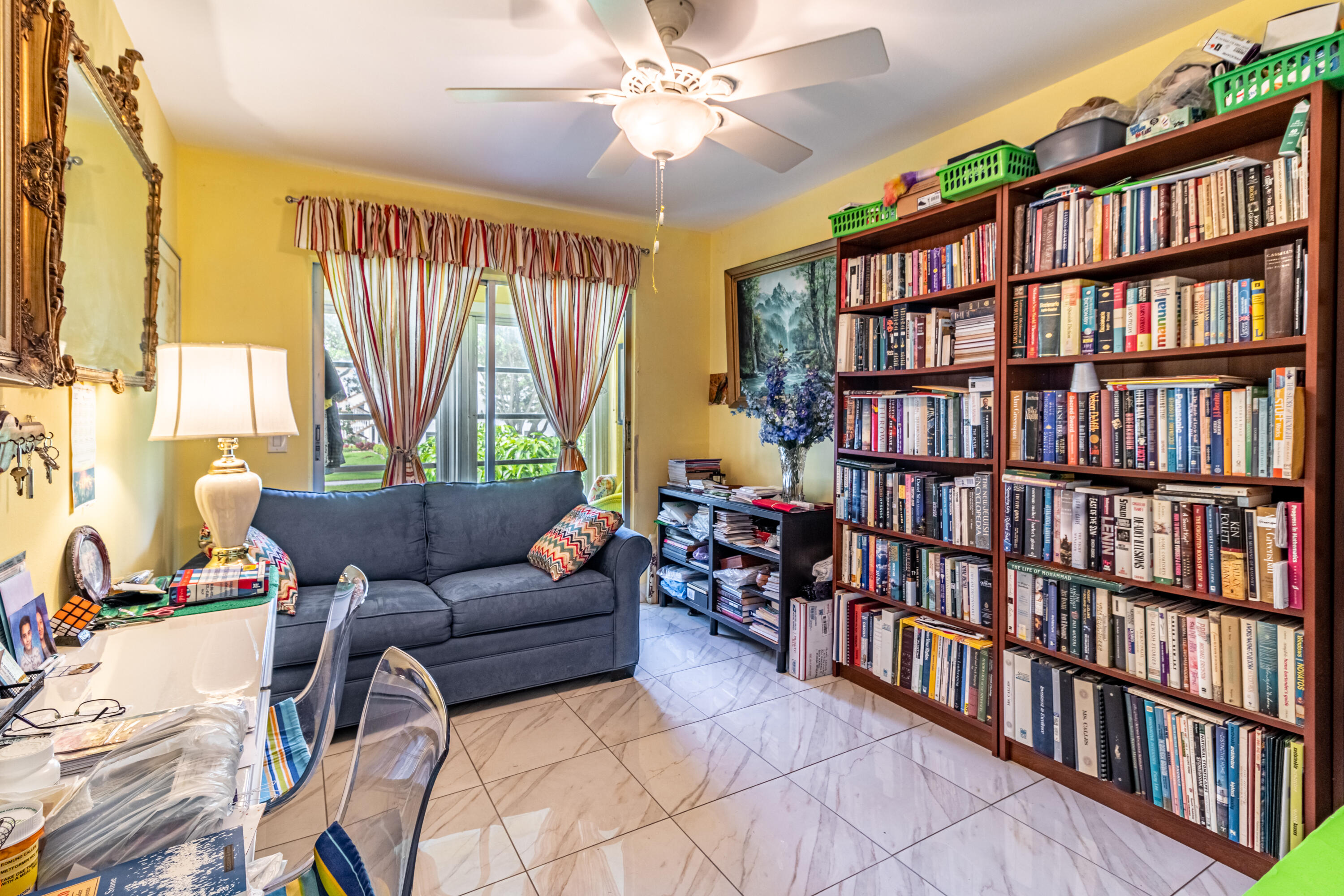 351 Mansfield I Boca Raton, FL 33434 - Photo 13 of 18 a living room with furniture and a book shelf