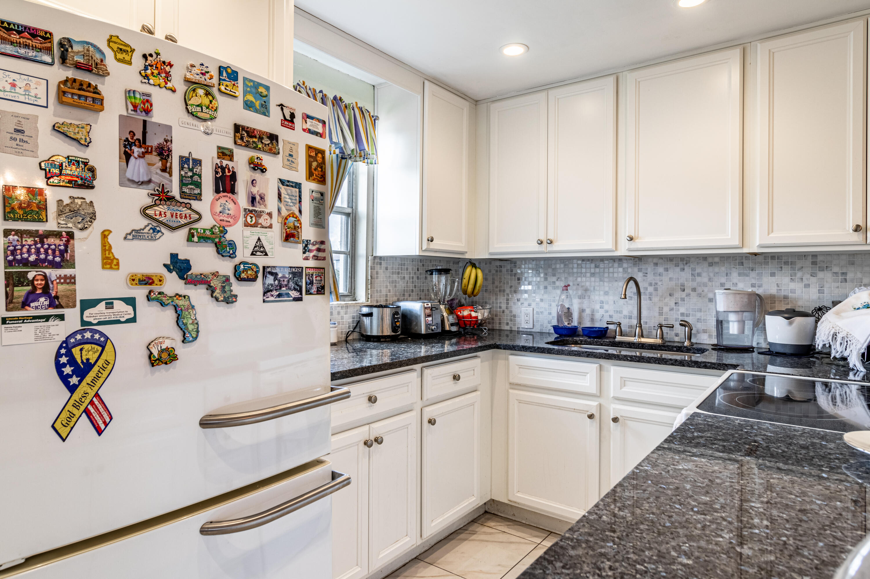 351 Mansfield I Boca Raton, FL 33434 - Photo 15 of 18 a kitchen with a white cabinets and sink