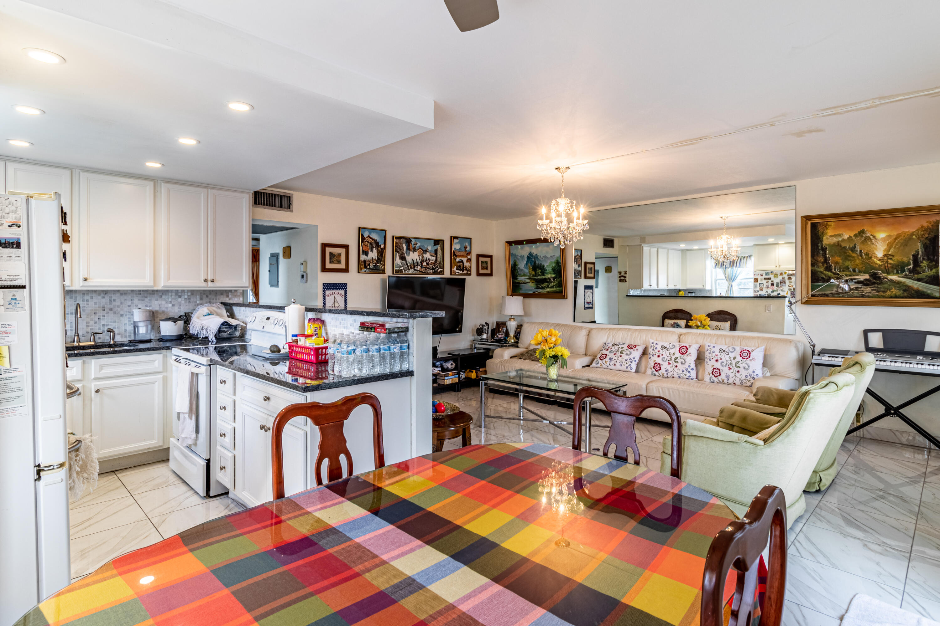 351 Mansfield I Boca Raton, FL 33434 - Photo 16 of 18 a living room with furniture and a flat screen tv