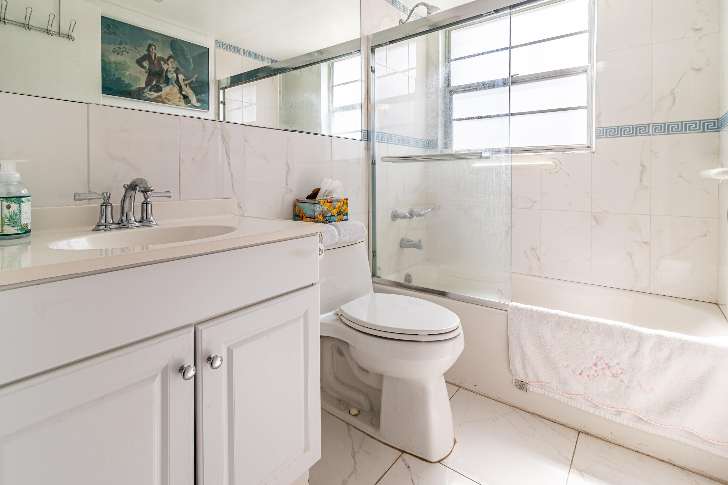 351 Mansfield I Boca Raton, FL 33434 - Photo 7 of 18 a bathroom with a sink a toilet and shower