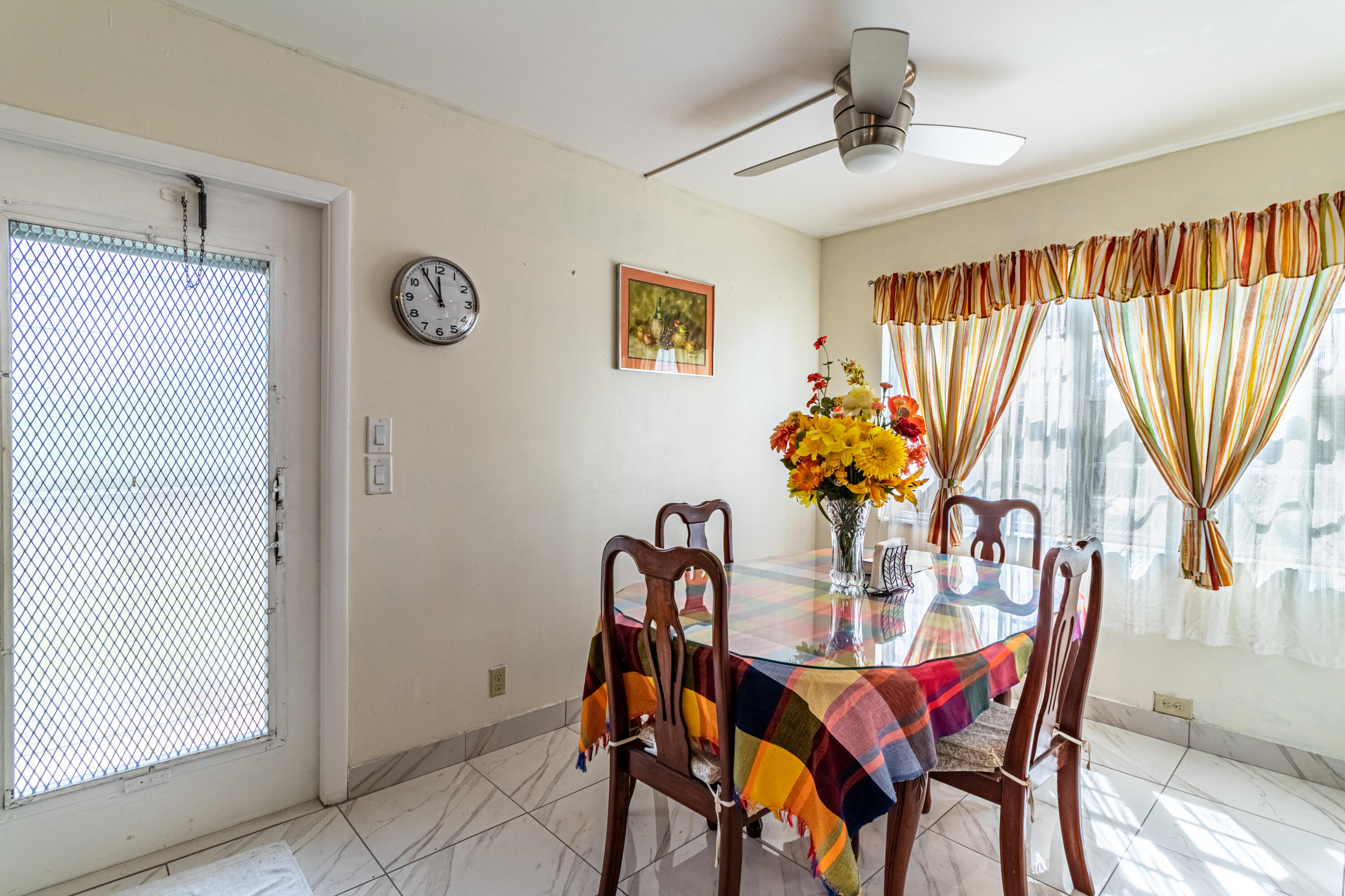 351 Mansfield I Boca Raton, FL 33434 - Photo 9 of 18 a dining room with furniture and window