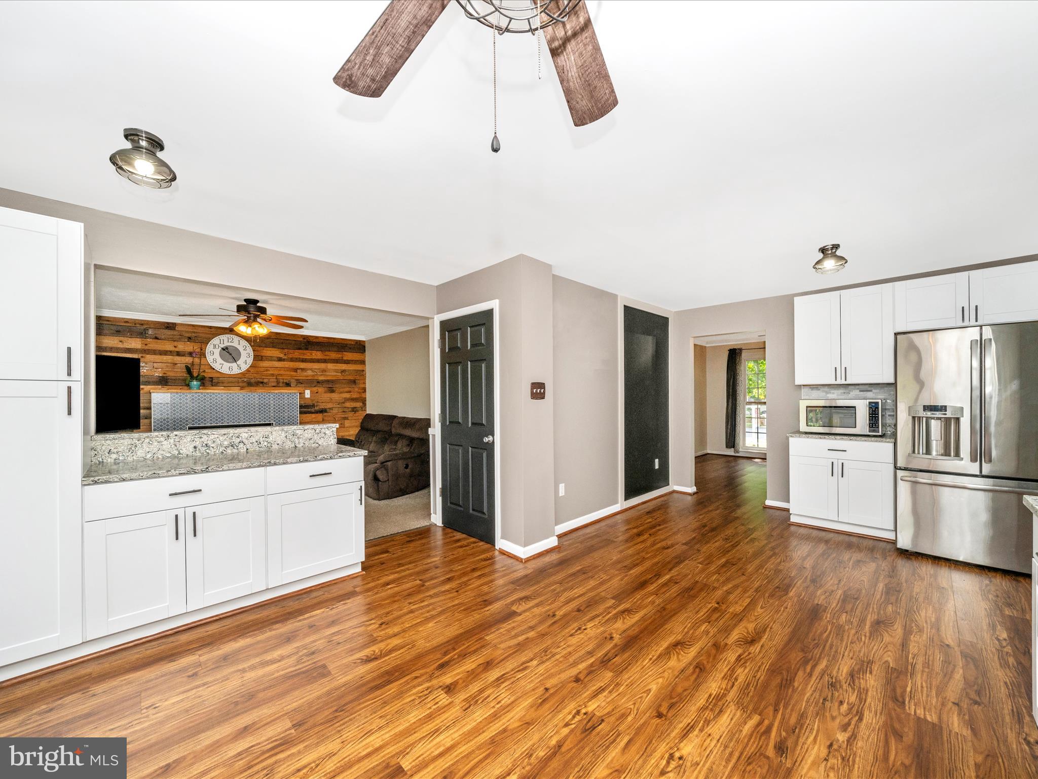 5004 Mallard Lane Frederick, MD 21703 - Photo 14 of 35 a kitchen with stainless steel appliances a refrigerator and a stove top oven