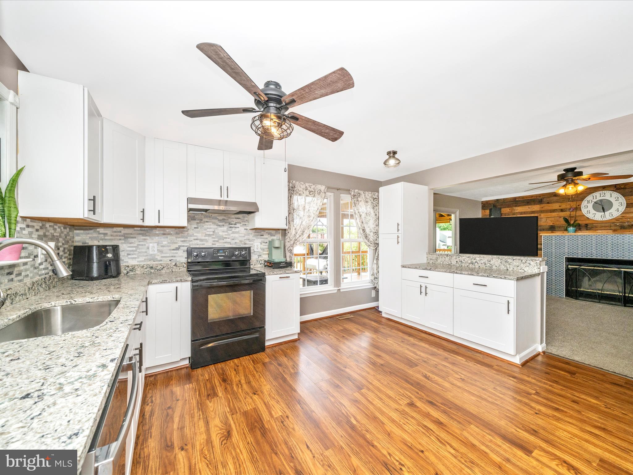 5004 Mallard Lane Frederick, MD 21703 - Photo 17 of 35 a kitchen with a stove a sink and a refrigerator
