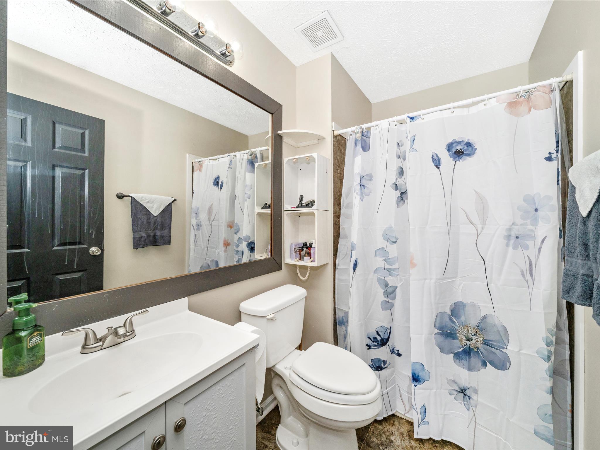5004 Mallard Lane Frederick, MD 21703 - Photo 24 of 35 a white toilet sitting next to a bathroom sink