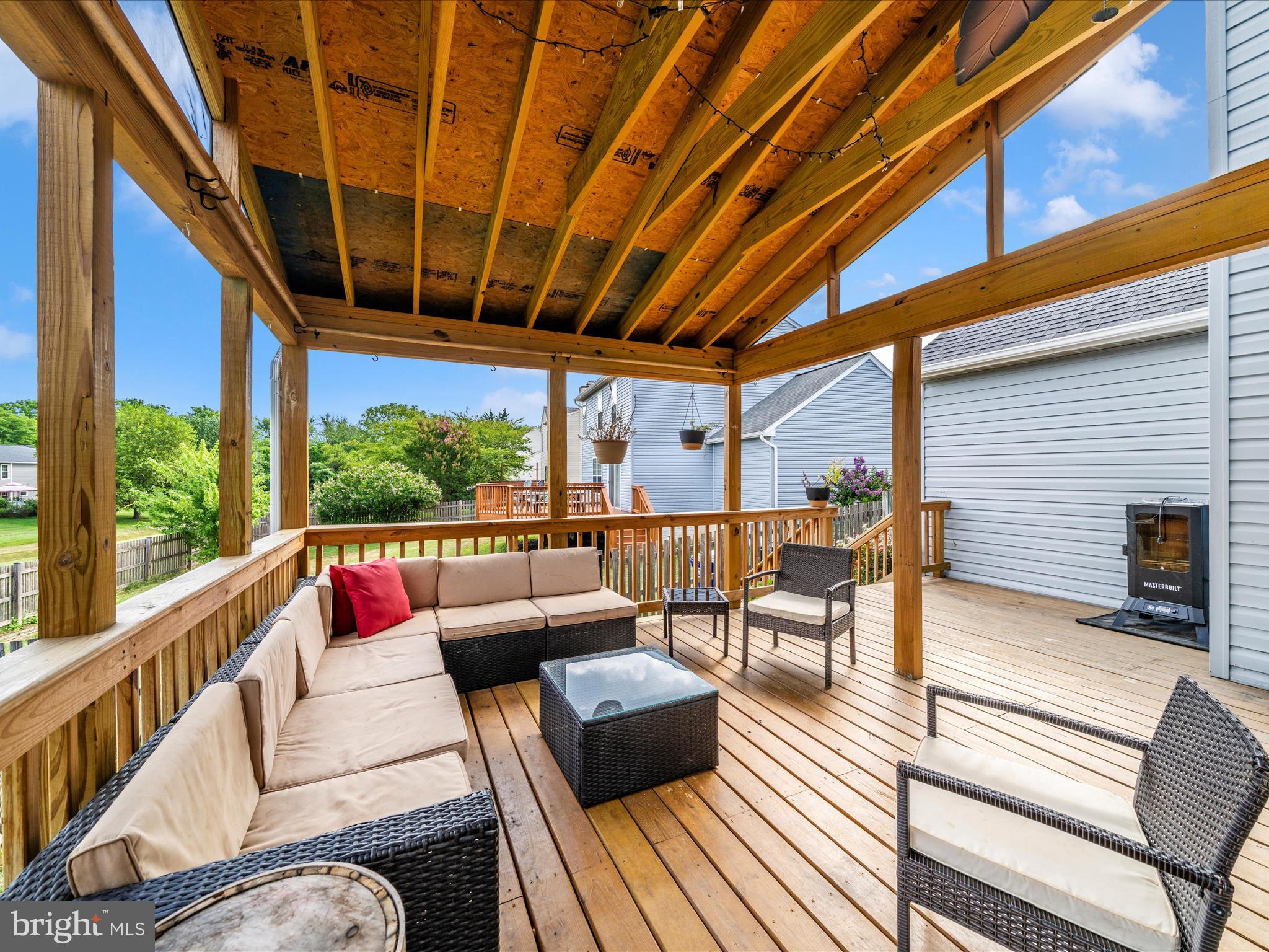 5004 Mallard Lane Frederick, MD 21703 - Photo 3 of 35 a balcony with furniture and wooden floor