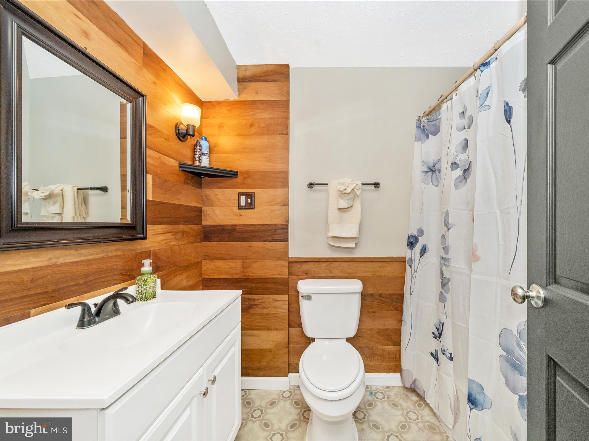 5004 Mallard Lane Frederick, MD 21703 - Photo 31 of 35 a bathroom with a sink toilet vanity and shower