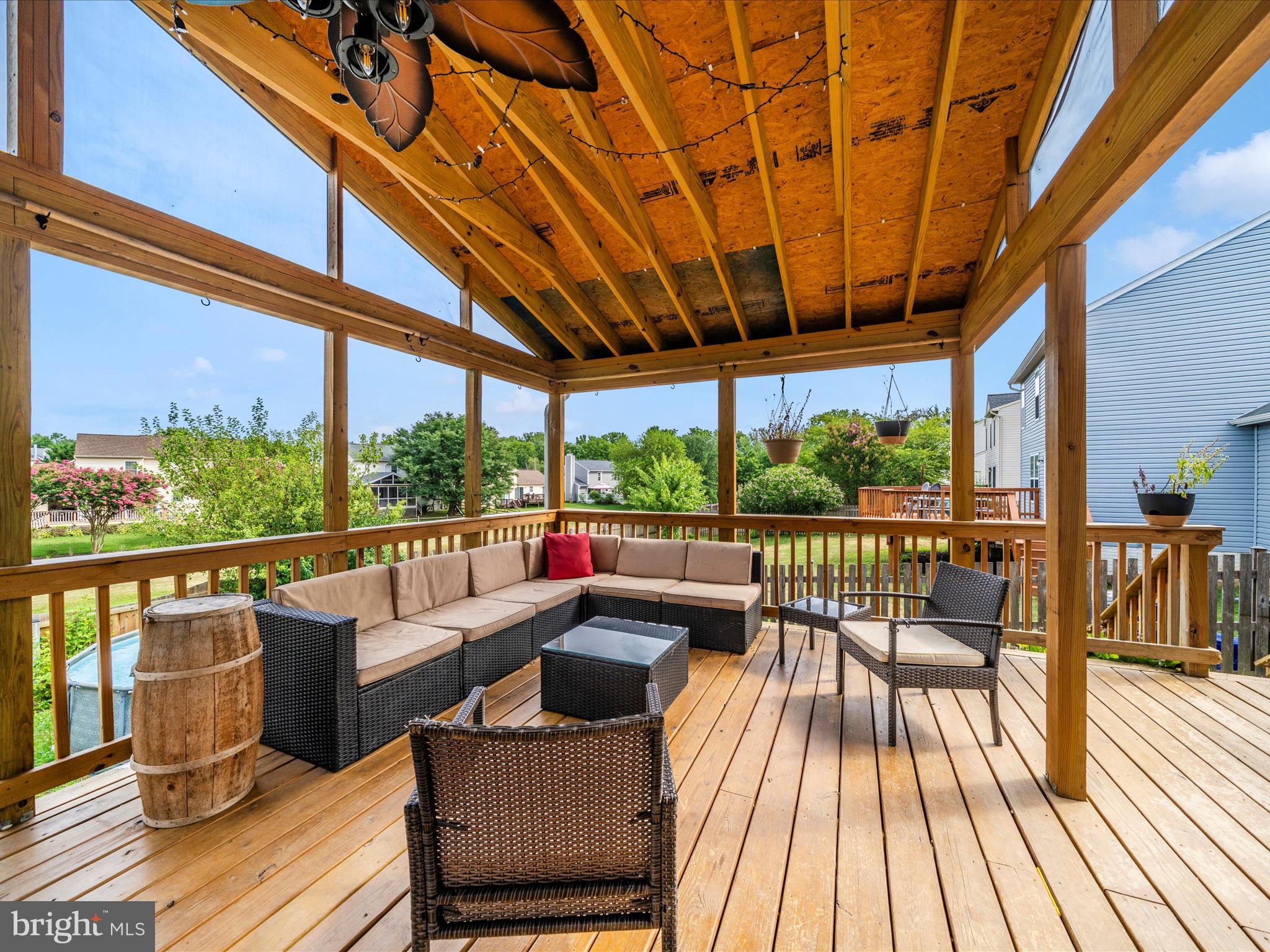 5004 Mallard Lane Frederick, MD 21703 - Photo 4 of 35 a view of balcony with couch and wooden floor