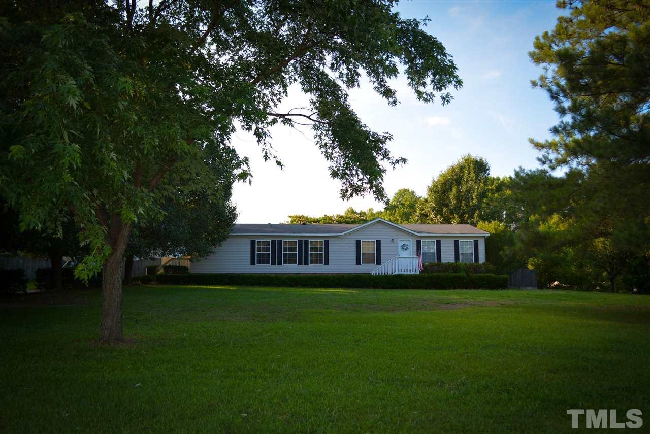 7236 Pecan Tree Street Willow Spring, NC 27592 - Photo 1 of 25 a view of a house with yard and green space