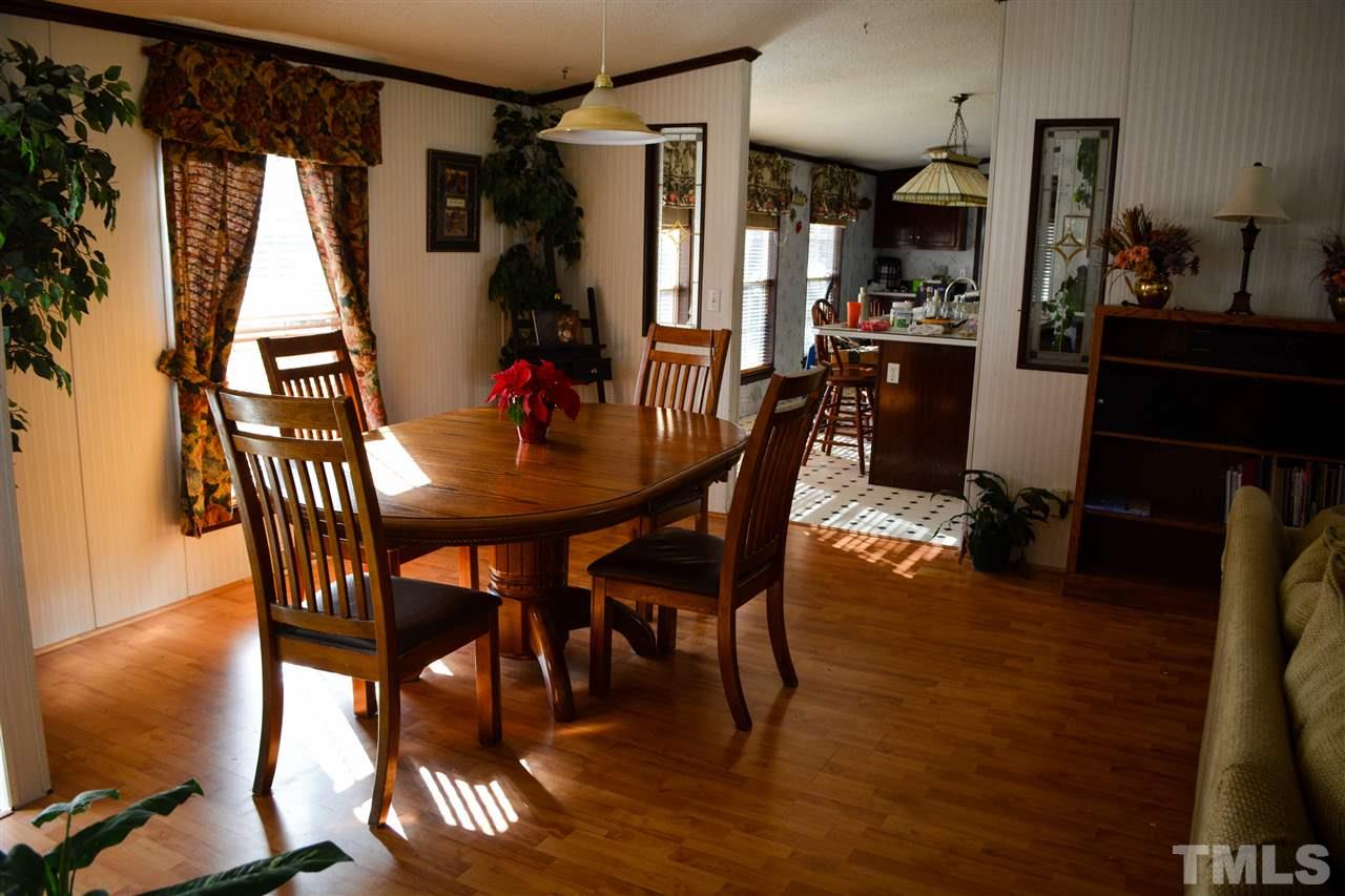7236 Pecan Tree Street Willow Spring, NC 27592 - Photo 22 of 25 a dining room with furniture and window