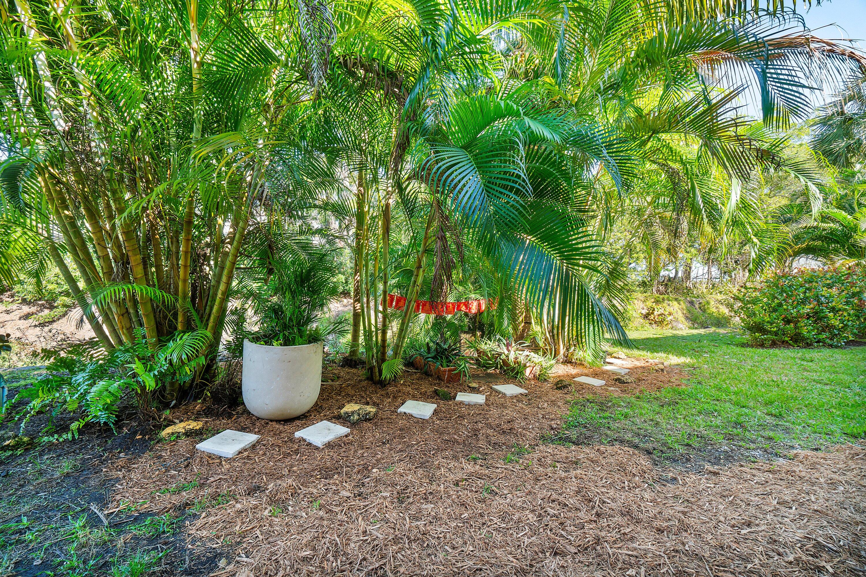 2805 Southwest 22nd Avenue, Unit 1040 Delray Beach, FL 33445 - Photo 16 of 18 a view of a backyard with garden