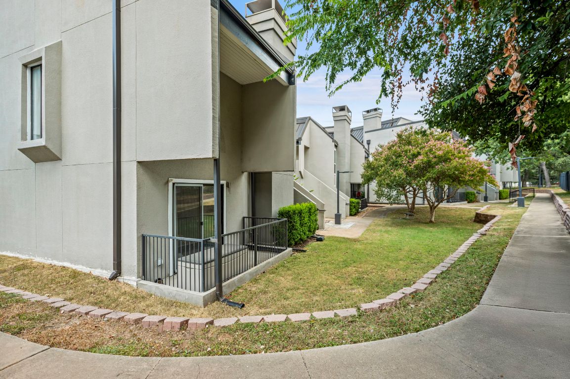935 La Posada Drive, Unit 148 Austin, TX 78752 - Photo 25 of 29 a view of a house with a yard