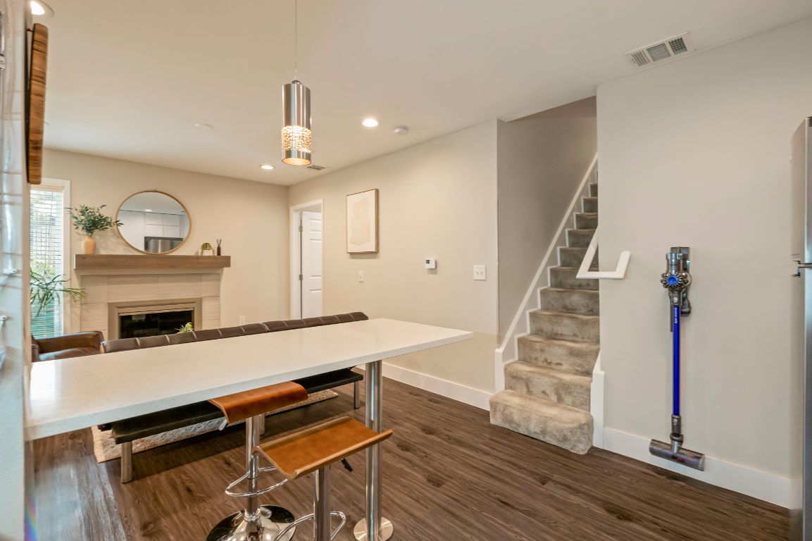 935 La Posada Drive, Unit 148 Austin, TX 78752 - Photo 10 of 29 a view of entryway and hall with wooden floor